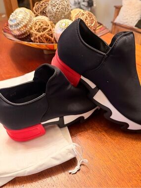 Women’s Black Slip-On Sneakers with Red Accent